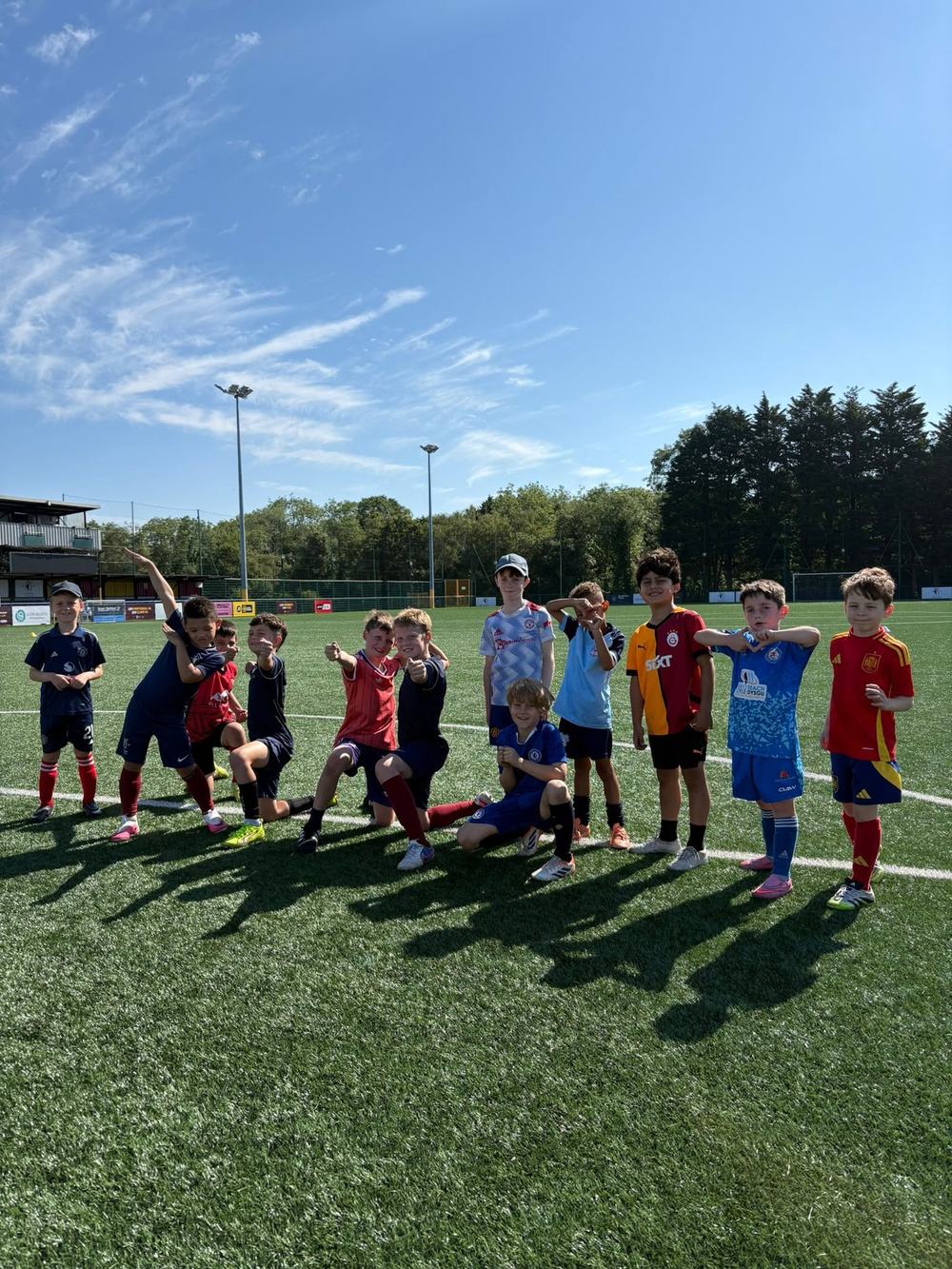 Younger Set Tempo players celebrating on the pitch